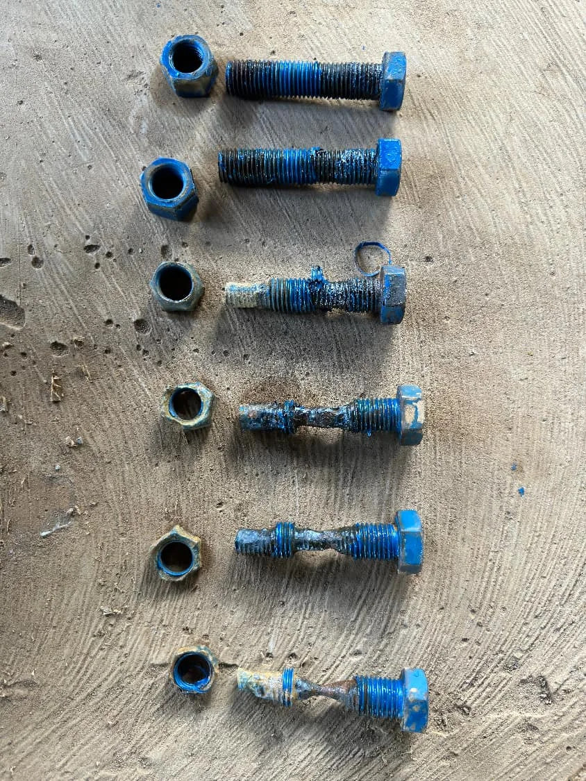 Worn metal valve parts after corrosive ore slurry service