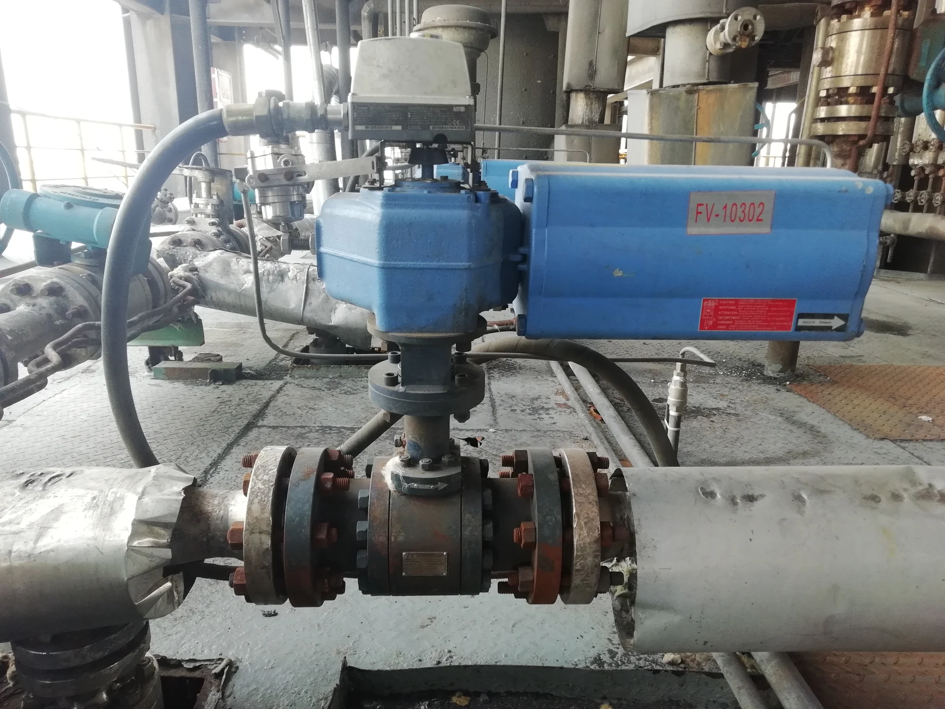 An actuated valve and insulated pipework in a coal-chemical installation