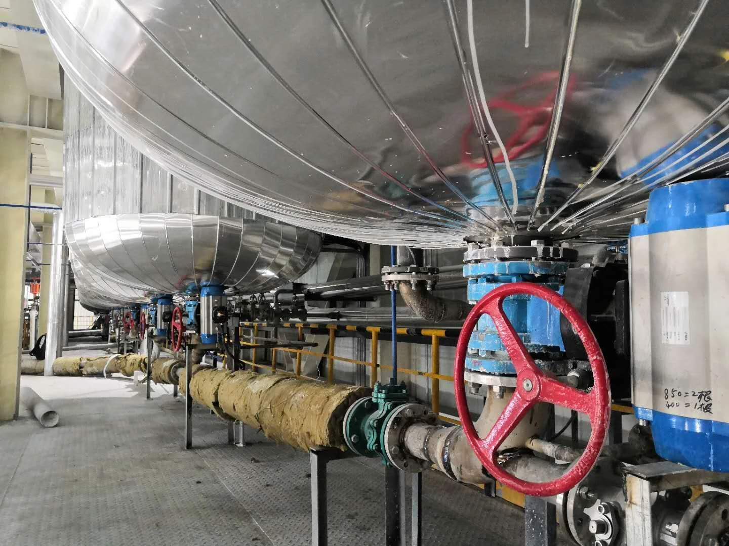 Valve assemblies beneath a lithium-processing vessel